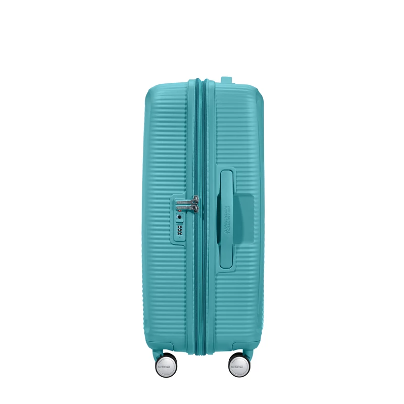 American Tourister Soundbox 4-kerekes keményfedeles bővíthető bőrönd 67 x 46.5 x 29/32 cm, türkiz