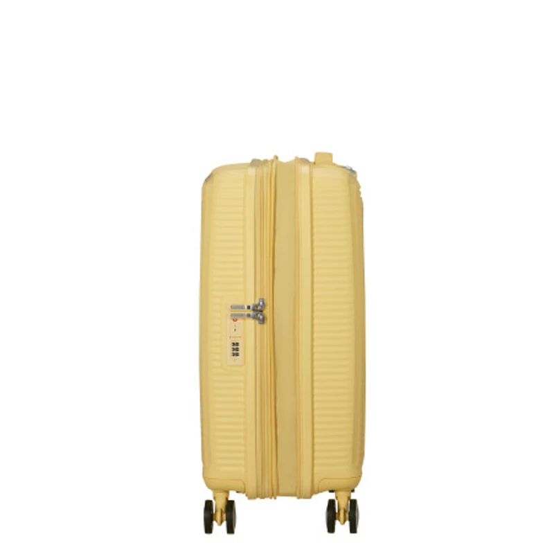 American Tourister Soundbox 4-kerekes keményfedeles bővíthető kabin bőrönd 55x40x20/23 cm, pasztell sárga