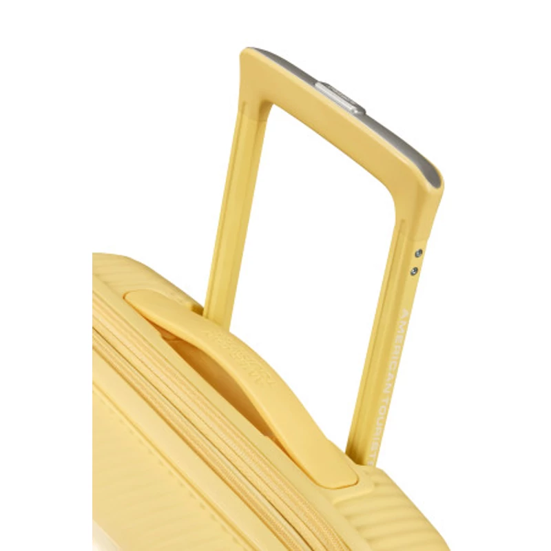 American Tourister Soundbox 4-kerekes keményfedeles bővíthető kabin bőrönd 55x40x20/23 cm, pasztell sárga