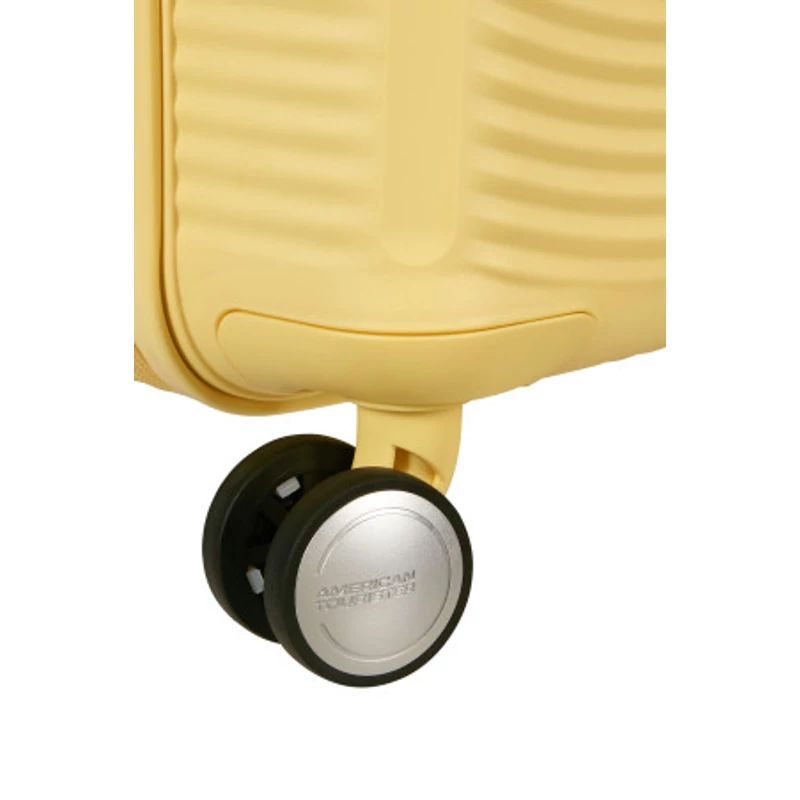 American Tourister Soundbox 4-kerekes keményfedeles bővíthető kabin bőrönd 55x40x20/23 cm, pasztell sárga